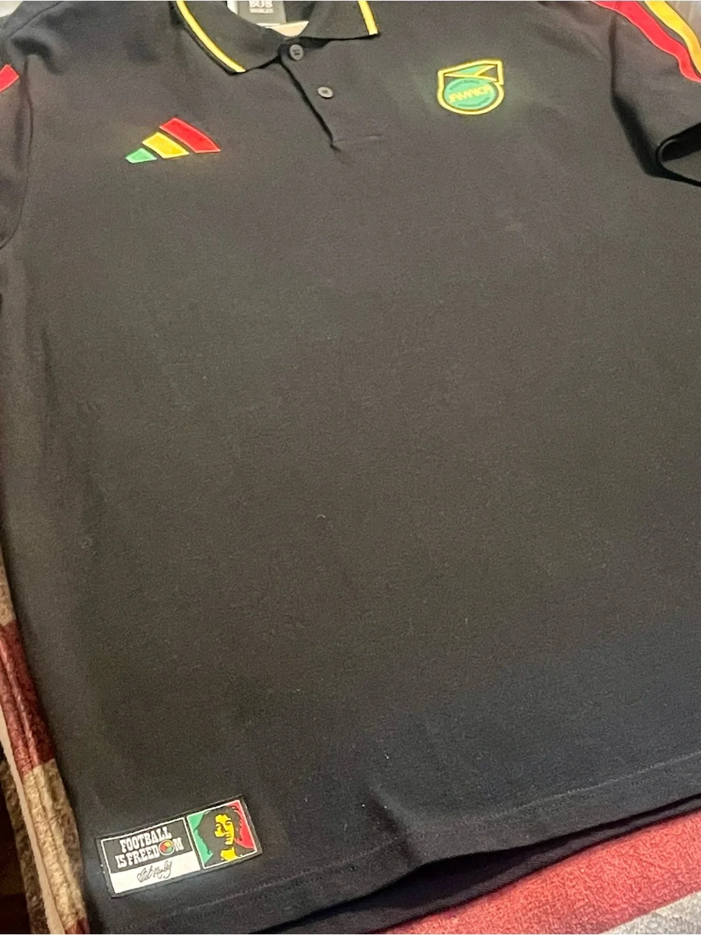 adidas Black Polo Shirt with Red, Yellow and Green Accents